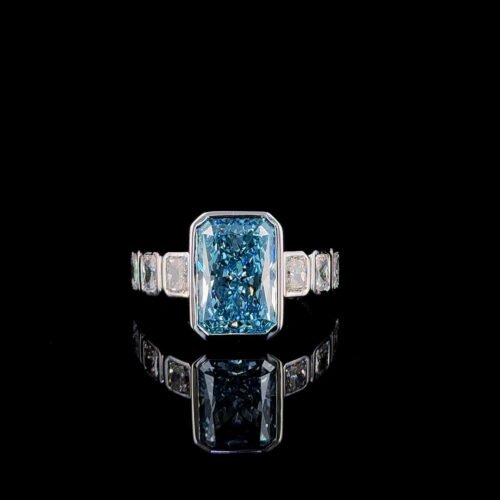 Solitaire fancy vivid blue radiant bezzel ring