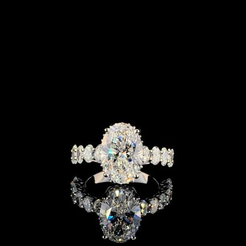 Solitaire center oval with side oval hidden halo ring