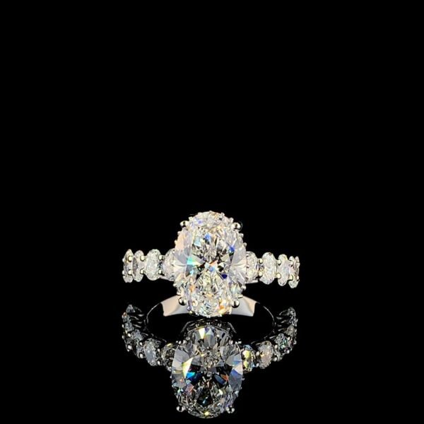 Solitaire center oval with side oval hidden halo ring